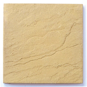 Yellow riven topped paving slab
